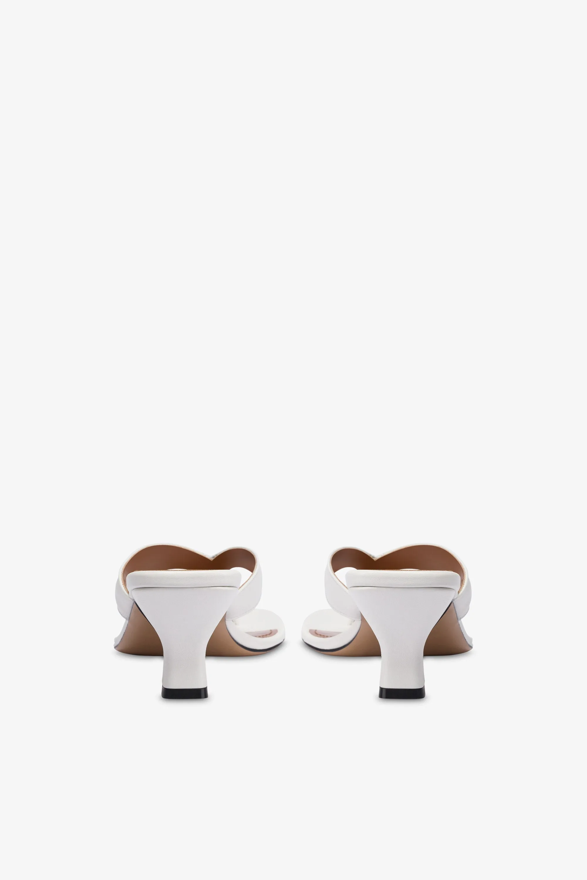 Mules with a toe in white leather