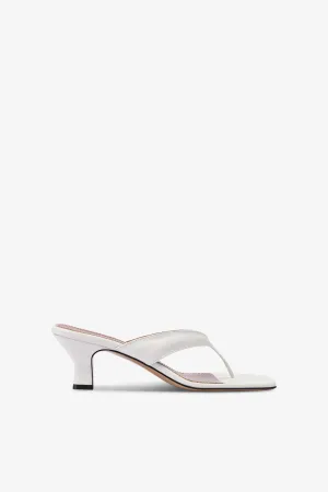 Mules with a toe in white leather