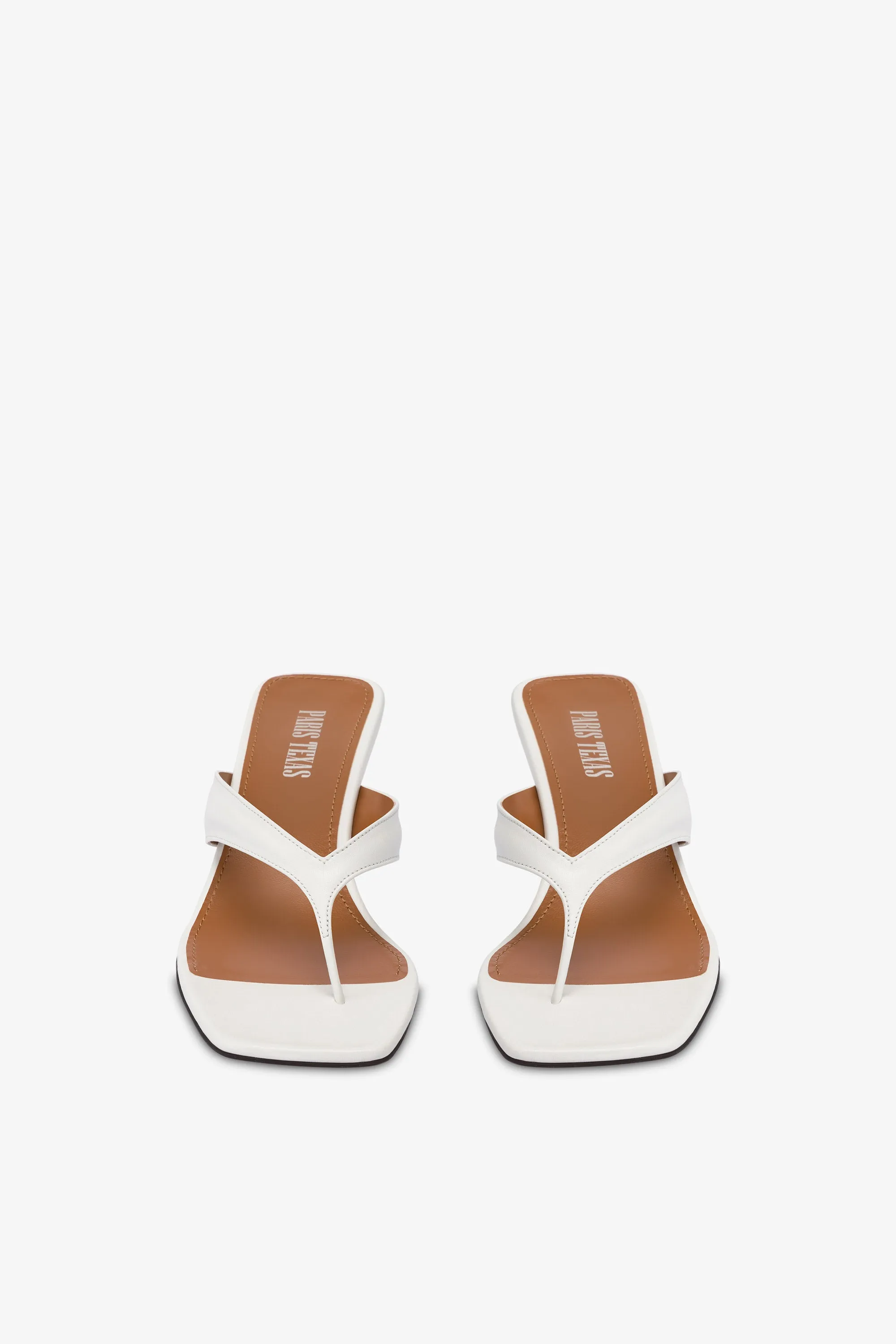 Mules with a toe in white leather