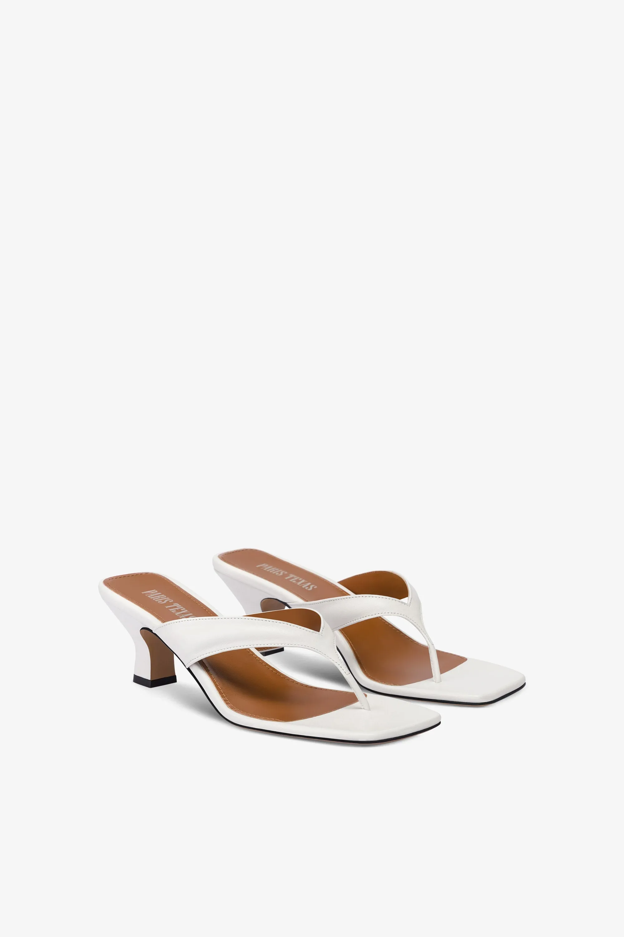 Mules with a toe in white leather